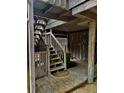 View underneath the structure showing the staircase, wood beams, and supports at 16 Twin Oaks Lane Ln, Isle of Palms, SC 29451