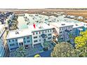 Aerial view of waterfront condos and marina, boasting a prime location at 1608 Marsh Harbor Ln # C, Mount Pleasant, SC 29464