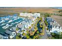 Aerial view of waterfront condos with a marina and marsh views at 1608 Marsh Harbor Ln # C, Mount Pleasant, SC 29464