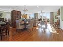 Open-concept living and dining area with hardwood floors and scenic views at 1608 Marsh Harbor Ln # C, Mount Pleasant, SC 29464