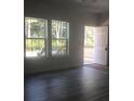 Naturally lit living room with sleek flooring and access to an outdoor deck at 183 Waverly Rd, Walterboro, SC 29488