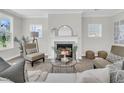 Cozy living room with fireplace, neutral furniture, and ample natural light at 232 O'Malley Dr, Summerville, SC 29483