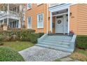 Inviting front entrance with well-manicured landscaping and a decorative wreath at 234 Rutledge Ave # D, Charleston, SC 29403