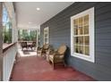 Relaxing outdoor space with wicker seating and a view of the lush surroundings at 3348 River Landing Rd, Johns Island, SC 29455