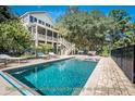 Stunning saltwater pool and jacuzzi, perfect for relaxing and enjoying starlit evenings in a private outdoor space at 8869 Marsh Aire Ln, Edisto Island, SC 29438