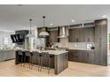 Open kitchen with island and breakfast bar, stainless steel appliances and sleek cabinetry at 915 Dill Ave, Charleston, SC 29412