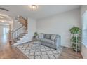 Cozy living room featuring hardwood floors, stairs, and stylish decor at 106 Kirkland St, Goose Creek, SC 29445