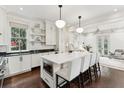 Bright kitchen with white cabinets, marble countertops, an island with seating, and stainless steel appliances at 121 Jakes Ln, Mount Pleasant, SC 29464