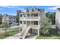 Beautiful raised home with double decks, inviting stairway, and well-kept yard at 1308 Lieben Rd, Mount Pleasant, SC 29466