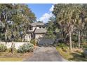 Well-maintained home with lush landscaping, an attached two-car garage, and a serene setting at 161 Marsh Hawk Ln, Kiawah Island, SC 29455