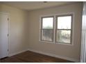 Bright bedroom with two windows and sleek wood-look flooring at 1927 Hazelwood Dr, Charleston, SC 29407