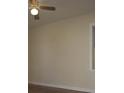 Neutral bedroom with ceiling fan and light-filled window at 1927 Hazelwood Dr, Charleston, SC 29407