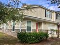 Inviting townhome with tan siding, stone accents, and a well-manicured lawn at 204 Tyner Trl, Summerville, SC 29486