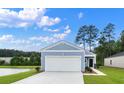 New home featuring blue siding, a two-car garage, and a scenic water view at 206 Pine Crest View Dr, Summerville, SC 29486