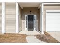Inviting front entry with a black door, white trim, and house number detail at 215 Evesham Dr, Summerville, SC 29485