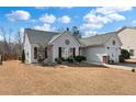 Charming house featuring manicured landscaping, a well-maintained lawn, and an inviting entryway at 219 Border Rd, Goose Creek, SC 29445