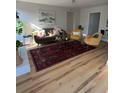 Bright living room featuring hardwood floors, a modern sofa, chairs, and stylish decor at 222 Braly Dr, Summerville, SC 29485
