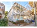 Charming two-story home with a inviting porch and balcony, beautiful curb appeal at 243 Rutledge Ave, Charleston, SC 29403