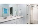 Well-lit bathroom featuring a double vanity with modern faucets and a shower-tub combo at 300 Pine Crest View Dr, Summerville, SC 29486