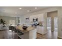 Open-concept kitchen with granite countertops, stainless appliances, and seating at island at 304 Pine Crest View Dr, Summerville, SC 29486