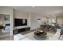 Bright living room seamlessly connects to the kitchen with modern decor at 304 Pine Crest View Dr, Summerville, SC 29486