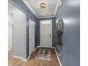 Welcoming foyer with stylish flooring, tasteful decor, and neutral walls, leading to the rest of the home at 407 Squire Pope Rd, Summerville, SC 29486