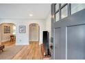 Inviting entryway with hardwood floors, shiplap accents, and arched doorways at 4522 S Rhett Ave, North Charleston, SC 29405