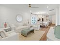 Open-concept living room with hardwood floors, modern furniture, and bright lighting at 1030 Sagegrass St, Summerville, SC 29485