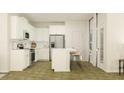 Bright, white kitchen featuring stainless steel appliances, island with breakfast bar, and lots of natural light at 1031 Sagegrass St, Summerville, SC 29485