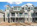 Exterior of townhome featuring double balconies and screened in patio with a blue sky at 130 River Landing Dr # 5108, Charleston, SC 29492