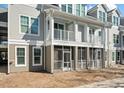 Exterior of townhome featuring double balconies and screened in patio and landscaping at 130 River Landing Dr # 5108, Charleston, SC 29492