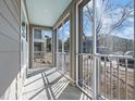 A screened porch featuring views of the neighborhood and lots of natural light at 130 River Landing Dr # 5108, Charleston, SC 29492