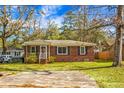 Charming brick home with a screened porch and ample yard space at 137 Dowling Ave, Walterboro, SC 29488