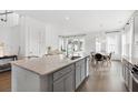 Kitchen island with granite countertops, seating, and stainless steel appliances with a view of the dining area at 1439 Clay Field Trl, Summerville, SC 29485