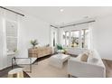 Bright and airy living room filled with natural light and features stylish contemporary furnishings at 1439 Clay Field Trl, Summerville, SC 29485