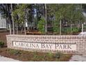 Carolina Bay Park entrance with brick signage surrounded by mature trees at 1724 Grovehurst Dr, Charleston, SC 29414