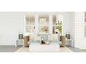 Stylish outdoor space with wicker sofa, plush pillows, chandelier and neutral decor at 214 Denham St, Summerville, SC 29486
