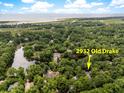 Expansive aerial view of the property's location at 2932 Old Drake amidst lush greenery and nearby water features at 2932 Old Drake Dr, Seabrook Island, SC 29455
