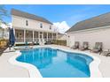 Beautiful backyard with a private pool, hot tub, and plenty of space for outdoor entertaining and relaxation at 3587 Clambank Dr, Mount Pleasant, SC 29466