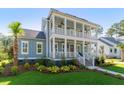 Two-story home boasting spacious double porches, blending southern charm with modern elegance at 3859 Segars Lndg, Mount Pleasant, SC 29466