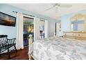 Bright bedroom featuring a light blue walls, and a private balcony entrance at 796 Summerwind Cir, Edisto Beach, SC 29438