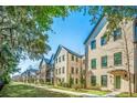 Attractive street showcasing a row of modern brick townhomes with manicured lawns and walkways at 1641 Florentia St, Mount Pleasant, SC 29464