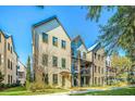 Beautiful street view showcasing modern townhomes with brick and light blue siding at 1641 Florentia St, Mount Pleasant, SC 29464