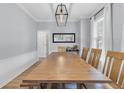 Spacious dining room featuring a large wooden table and bench seating, perfect for Gathering gatherings and dinner parties at 1821 Great Hope Dr, Mount Pleasant, SC 29466