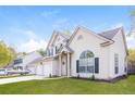 Well-maintained two-story home with lush green lawn, a two-car garage and traditional architectural details at 204 Candleberry Cir, Goose Creek, SC 29445
