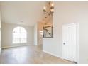 Inviting living area featuring hardwood floors, natural light, chandelier and open layout at 204 Candleberry Cir, Goose Creek, SC 29445