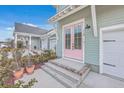 Eye-catching, close-up of the pink double front door with glass panes and house number 219 at 219 Clearblue Loop, Summerville, SC 29486