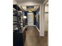 Elegant entryway with hardwood floors, stylish decor, and a tray ceiling at 236 River Martin Ct, Summerville, SC 29483
