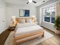 Comfortable bedroom with a soft color scheme, plush rug, modern lamps, and a large window with privacy blinds at 45 Sycamore Ave # 1413, Charleston, SC 29407