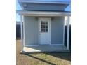 Backyard storage shed with a covered porch, offering secure space for tools, equipment, and lawn furniture at 619 Ravens Wood Rd, Summerville, SC 29486